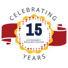 the number 15 in a yellow circle above the GRC logo, with the words "celebrating years" above and under. 